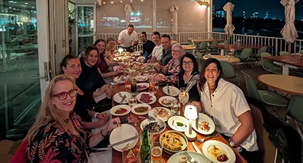 Cohort One at a meal during the Executive AI Residency